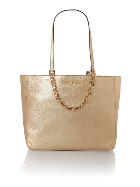 michael kors gold weave basket handbag|Michael Kors gold clutch bag.